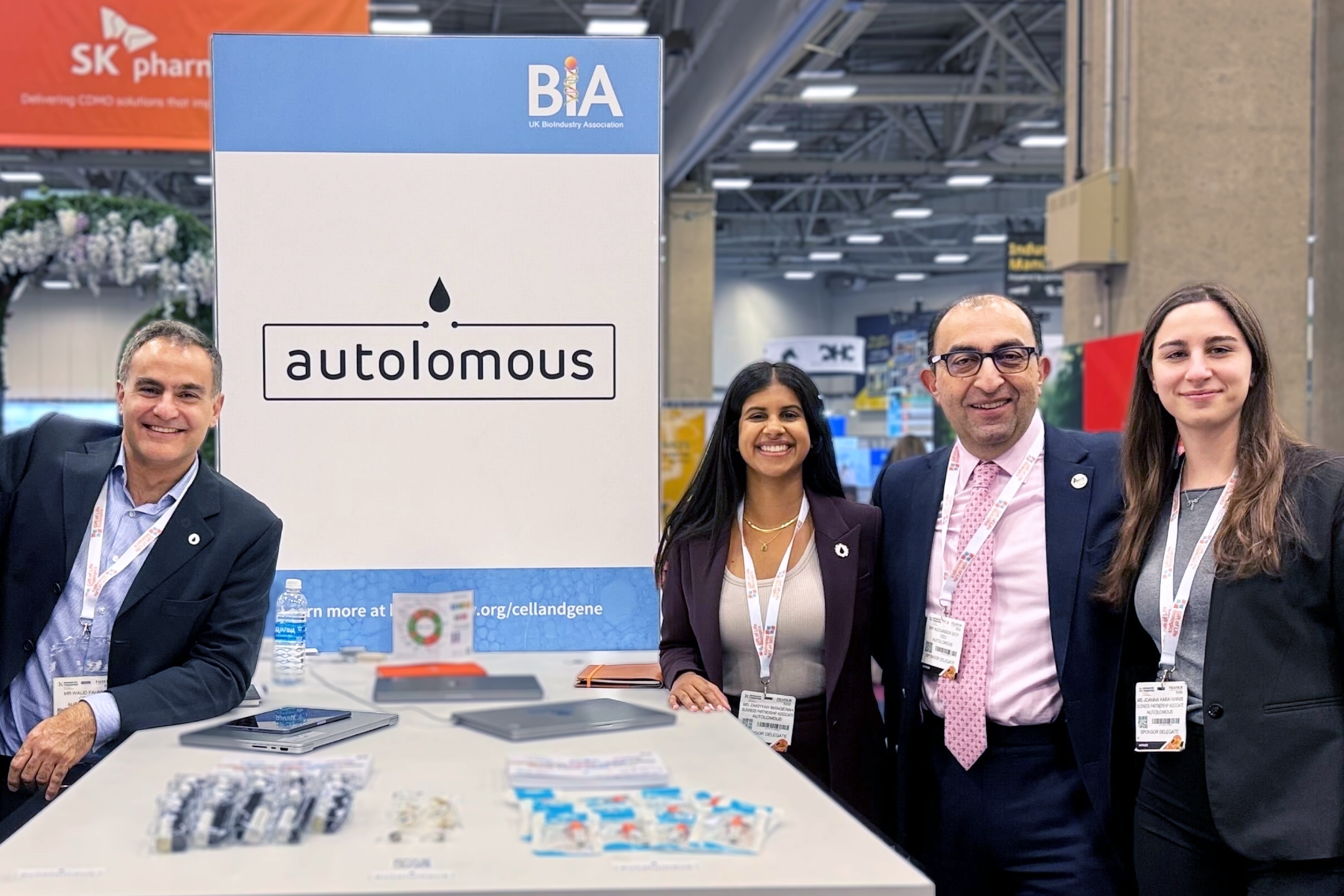 Autolomous team at biotech conference booth display