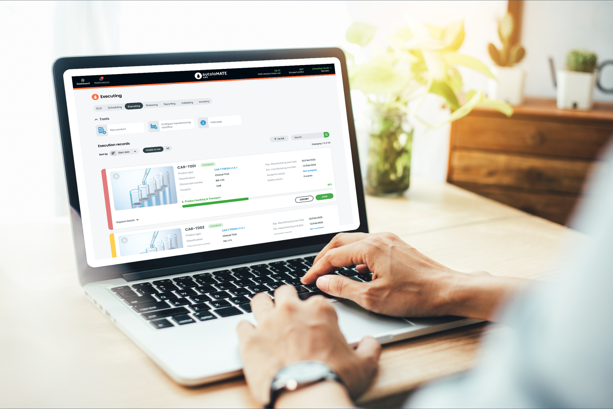 Person using manufacturing workflow software on laptop