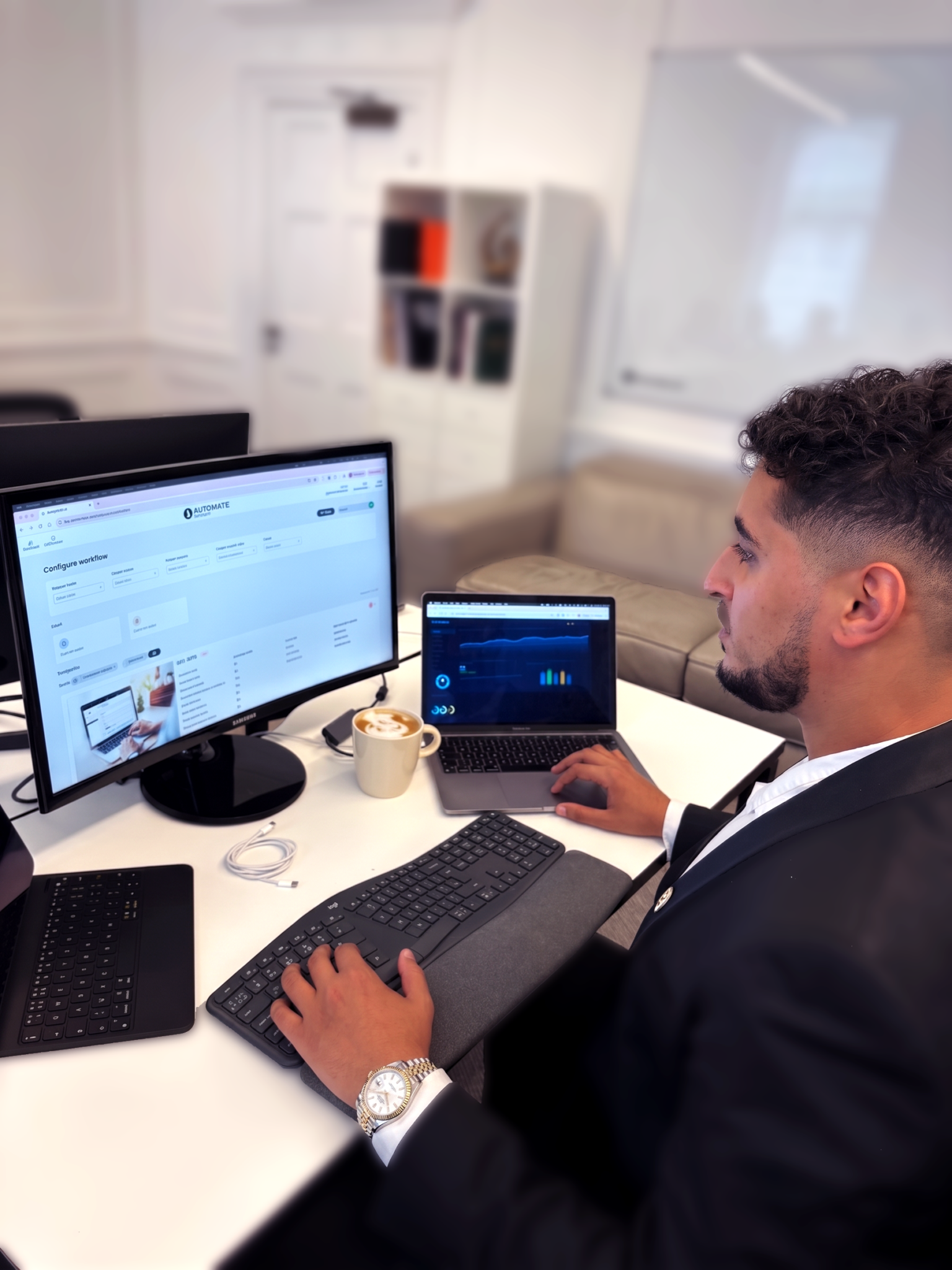 Business professional analyzing data on dual monitors